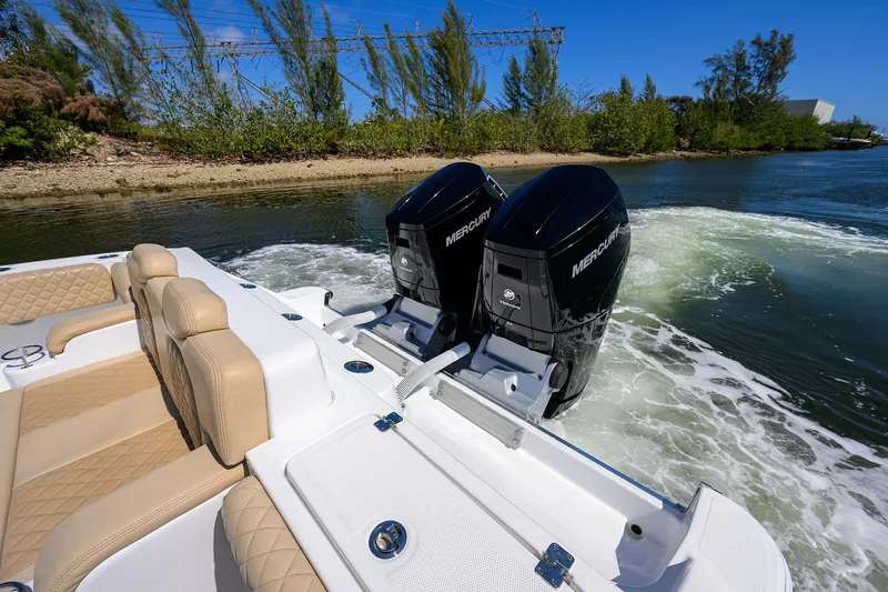 Slide: The Image of 2024 HCB 39 Speciale boat with twin Mercury outboard engines on a sunny day. - 40