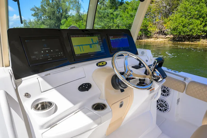 Slide: The Image of 2024 HCB 39 Speciale boat dashboard with advanced navigation and control systems. - 43