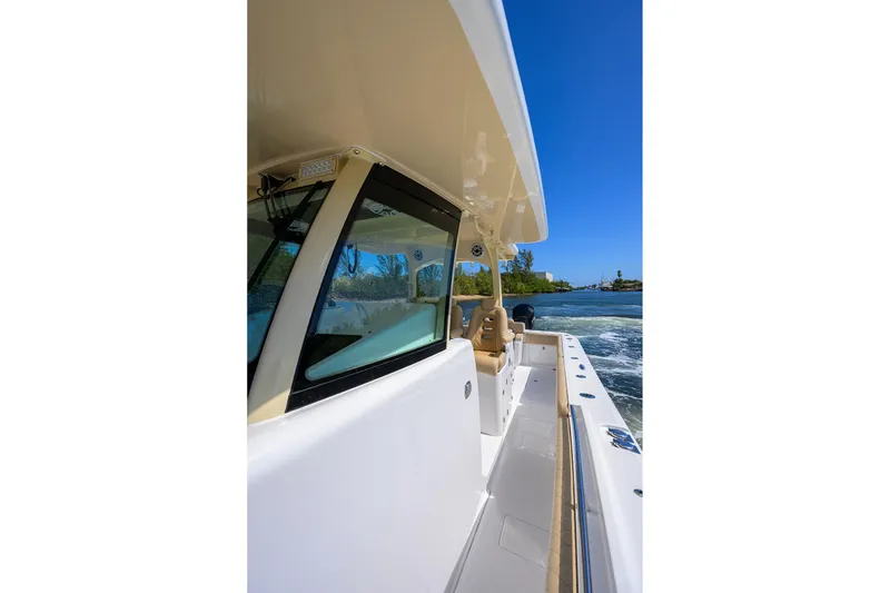Slide: The Image of 2024 HCB 39 Speciale boat cruising on a sunny day, side view. - 51