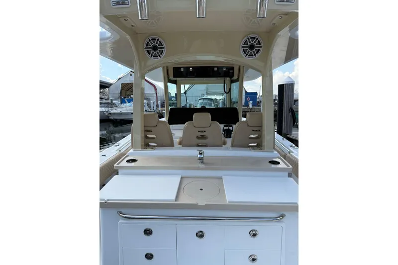 Slide: The Image of 2024 HCB 39 Speciale boat interior with seating and storage compartments. - 6
