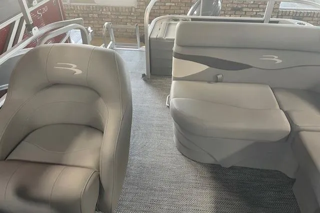Slide: The Image of 2024 Bennington 18SFV Fishing Barge interior with gray seating and carpeted floor. - 3