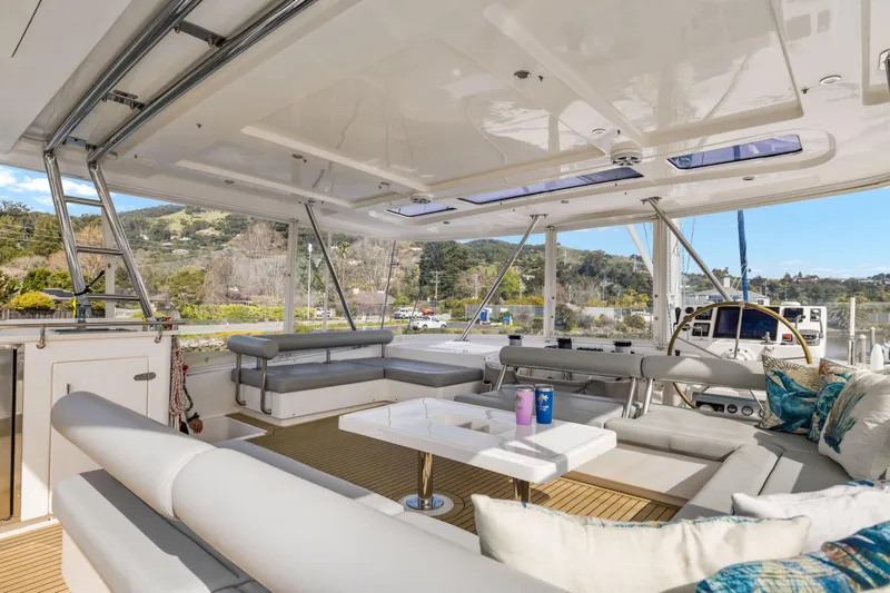 Slide: The Image of Luxurious 2015 Leopard 58 yacht interior with spacious seating and scenic views. - 11