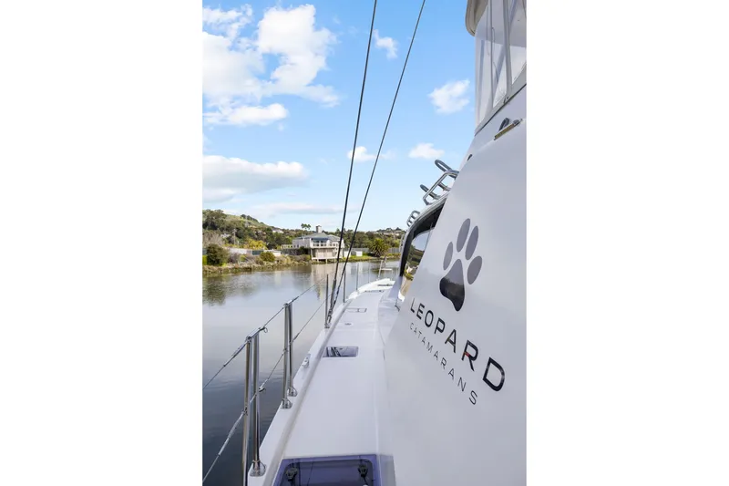 Slide: The Image of 2015 Leopard 58 catamaran on calm water under blue sky. - 17