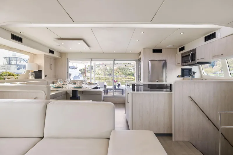 Slide: The Image of Luxurious interior of a 2015 Leopard 58 yacht with modern kitchen and dining area. - 24