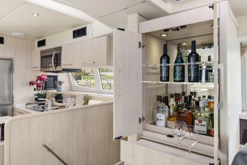 Slide: The Image of Luxurious Leopard 58 yacht interior with modern kitchen and well-stocked bar, 2015 model. - 33