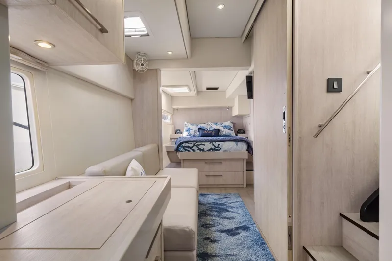 Slide: The Image of Luxurious interior of 2015 Leopard 58 yacht with modern bedroom and seating area. - 42
