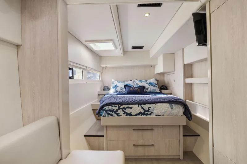Slide: The Image of Luxurious bedroom interior of 2015 Leopard 58 yacht with modern decor and natural light. - 44