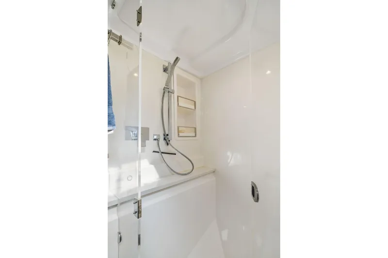 Slide: The Image of Modern shower area in 2015 Leopard 58 yacht with sleek fixtures and glass door. - 51