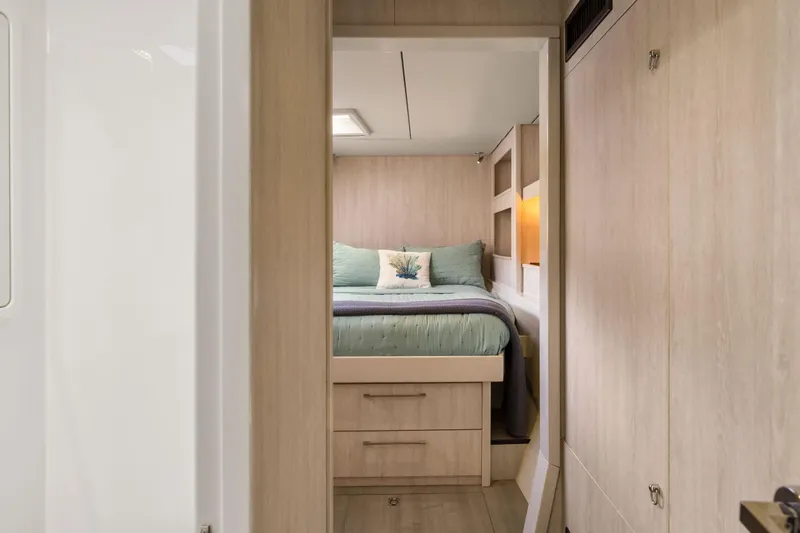 Slide: The Image of Luxurious bedroom interior of 2015 Leopard 58 yacht with modern wood finish. - 54