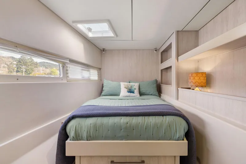 Slide: The Image of Luxurious bedroom interior of 2015 Leopard 58 yacht with cozy bedding and elegant decor. - 55