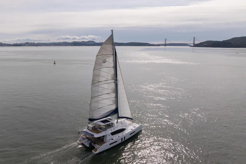 Slide: The Image of Sailing catamaran Leopard 58, 2015 model, cruising near Golden Gate Bridge on a calm day. - 6