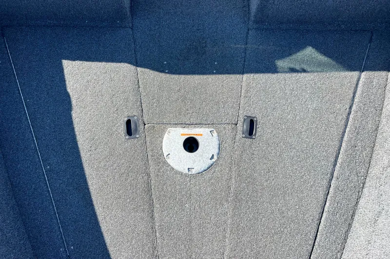 Slide: The Image of 2020 Lund 1675 Adventure Sport boat interior with carpeted flooring and seat base. - 11