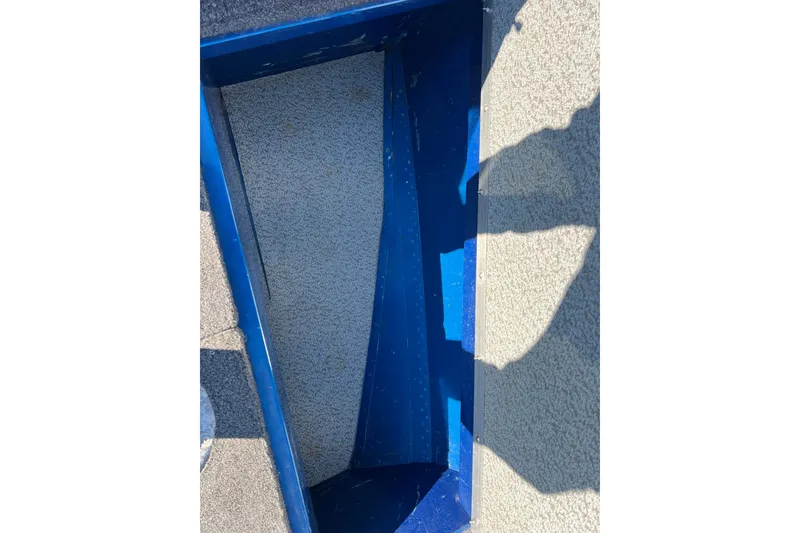 Slide: The Image of Interior view of a 2020 Lund 1675 Adventure Sport boat compartment. - 15