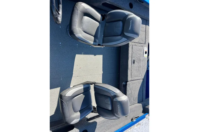 Slide: The Image of 2020 Lund 1675 Adventure Sport boat interior with two black seats. - 16