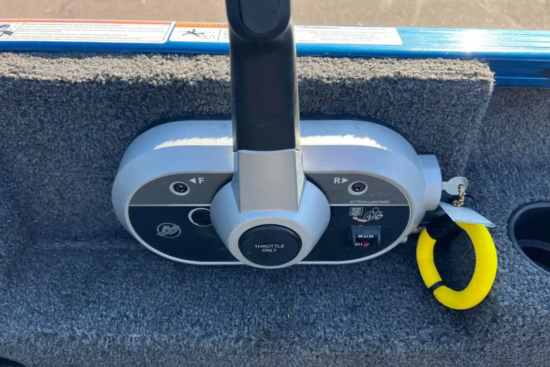 Slide: The Image of Control panel of 2020 Lund 1675 Adventure Sport boat with throttle and safety lanyard. - 22