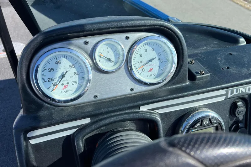 Slide: The Image of Dashboard of 2020 Lund 1675 Adventure Sport boat with speedometer and tachometer gauges. - 24