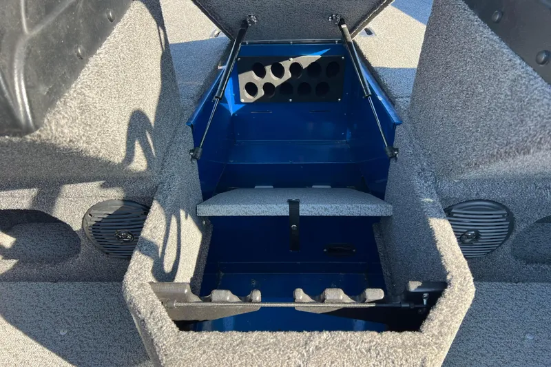Slide: The Image of 2020 Lund 1675 Adventure Sport boat interior storage compartment with carpeted finish. - 27