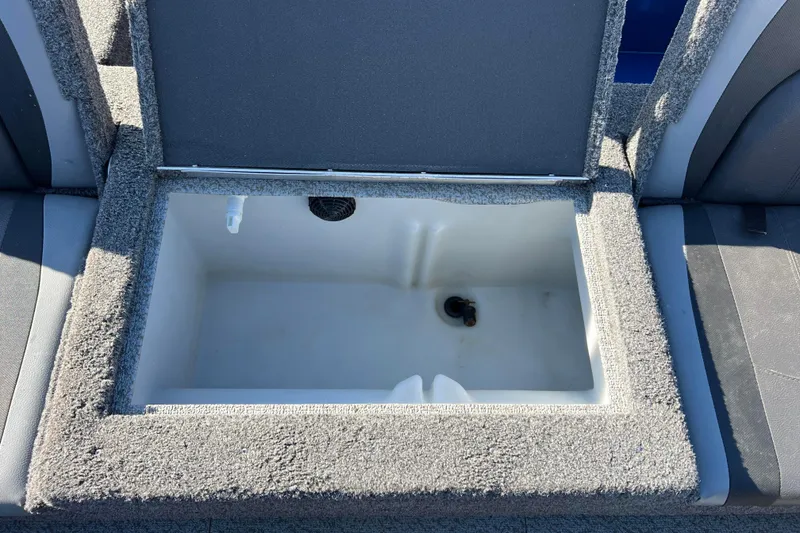 Slide: The Image of 2020 Lund 1675 Adventure Sport boat storage compartment, open and empty. - 28