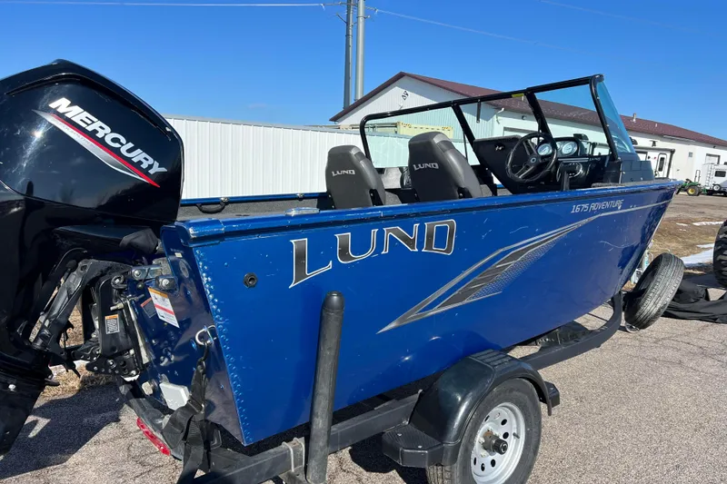 Slide: The Image of 2020 Lund 1675 Adventure Sport boat with Mercury engine on trailer. - 4