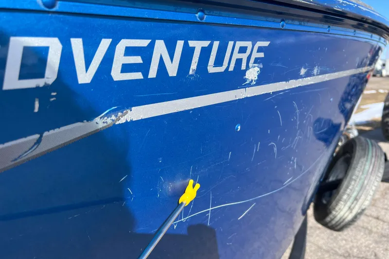 Slide: The Image of 2020 Lund 1675 Adventure Sport boat with visible scratches and paint damage. - 42