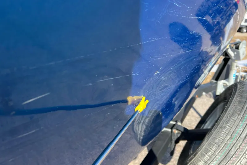 Slide: The Image of Close-up of a 2020 Lund 1675 Adventure Sport boat with visible scratches. - 45