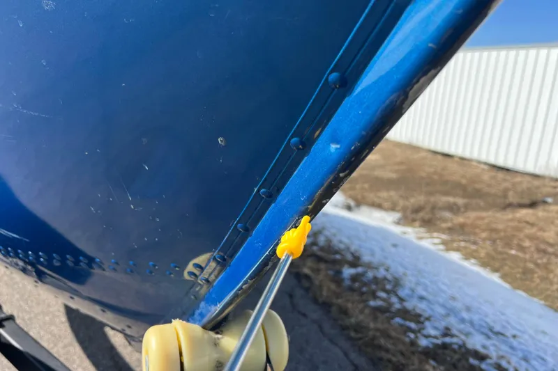 Slide: The Image of Close-up of a 2020 Lund 1675 Adventure Sport boat hull with blue paint and rivets. - 48