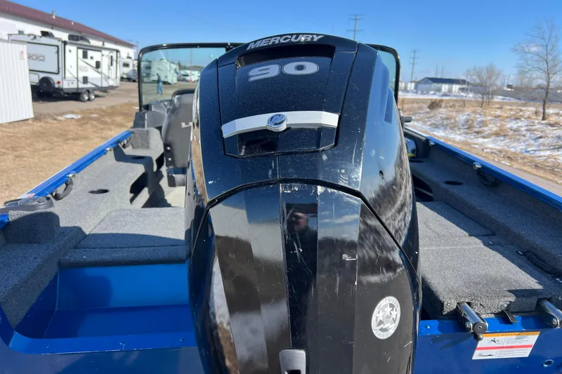 Slide: The Image of 2020 Lund 1675 Adventure Sport boat with Mercury 90 engine, parked outdoors. - 5