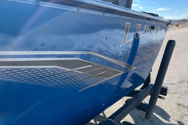 Slide: The Image of 2020 Lund 1675 Adventure Sport boat with blue exterior and sleek design. - 59