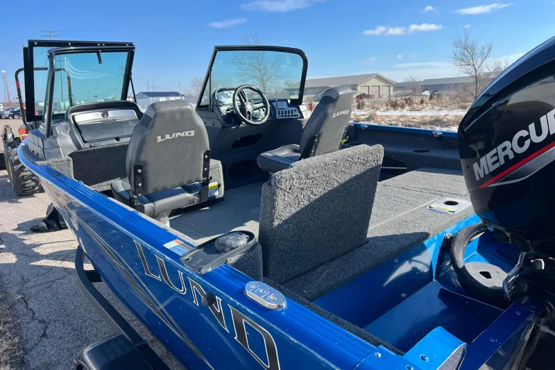 Slide: The Image of 2020 Lund 1675 Adventure Sport boat with Mercury engine, blue exterior, and spacious interior. - 64