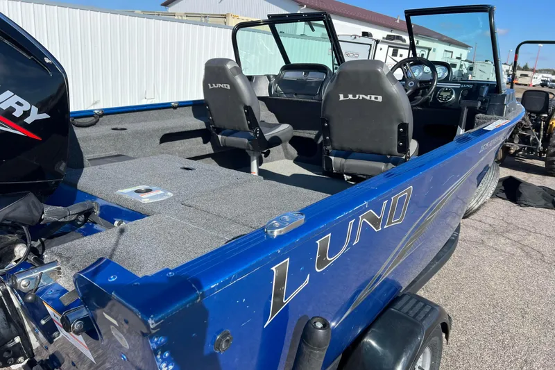 Slide: The Image of 2020 Lund 1675 Adventure Sport boat, blue exterior, spacious interior, dual seats, Mercury engine. - 65