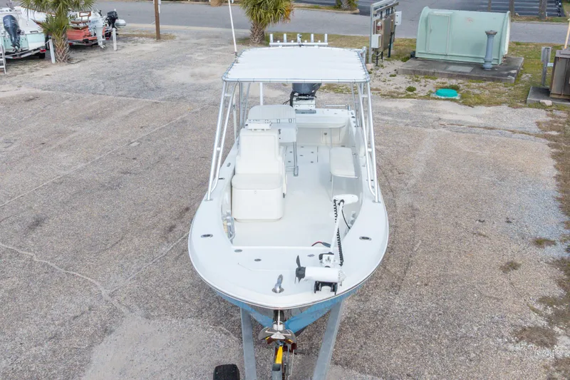 Slide: The Image of 2017 Andros Tarpon 26 boat on trailer, parked outdoors. - 12