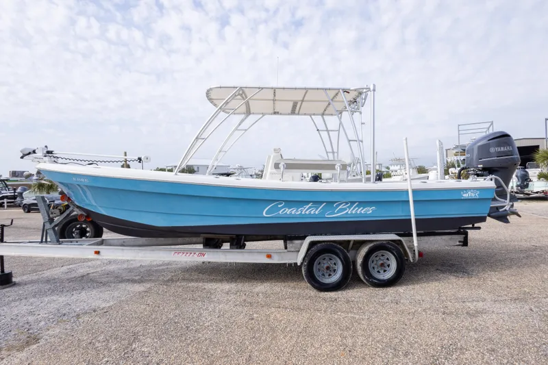 Slide: The Image of 2017 Andros Tarpon 26 boat "Coastal Blues" on trailer, side view. - 34