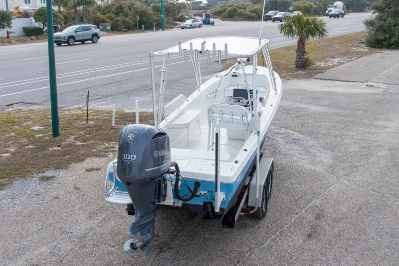 Slide: The Image of 2017 Andros Tarpon 26 boat with Yamaha 300 engine on trailer, parked near road. - 8