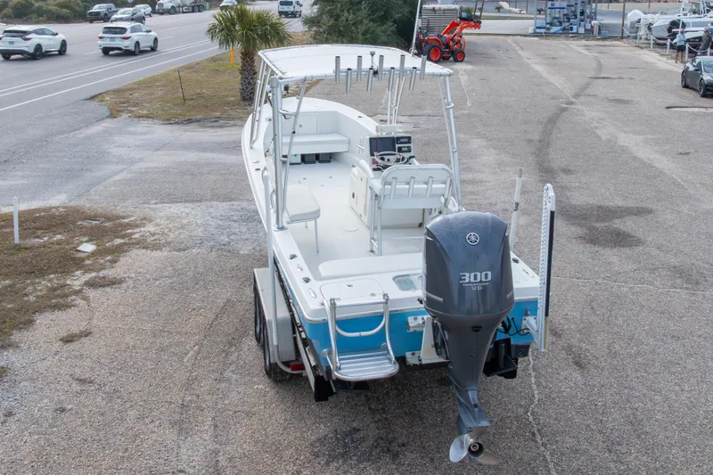 Slide: The Image of 2017 Andros Tarpon 26 boat with Yamaha 300 engine on trailer, parked near road. - 9