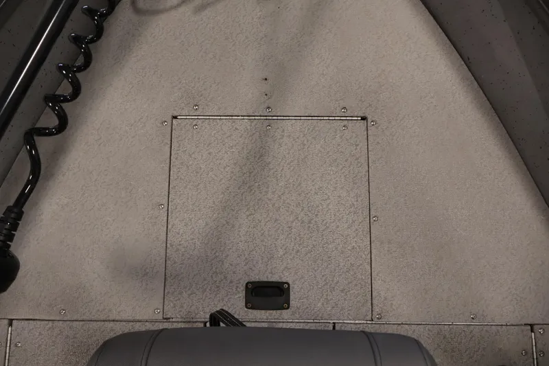 Slide: The Image of 2019 Crestliner 1800 Kodiak SC boat interior, featuring a textured floor and storage compartment. - 17