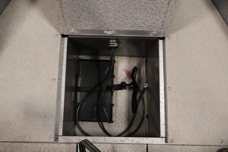 Slide: The Image of 2019 Crestliner 1800 Kodiak SC boat storage compartment with wiring and battery holder. - 18