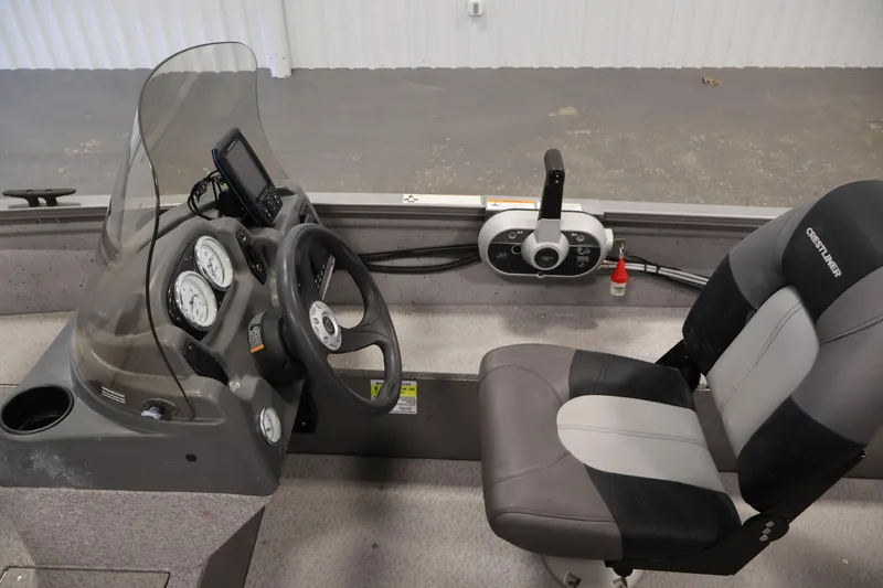 Slide: The Image of 2019 Crestliner 1800 Kodiak SC boat interior with steering console and seat. - 23