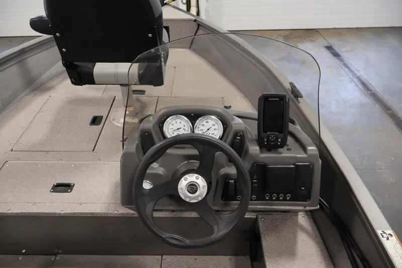 Slide: The Image of 2019 Crestliner 1800 Kodiak SC boat dashboard with steering wheel and Garmin device. - 24