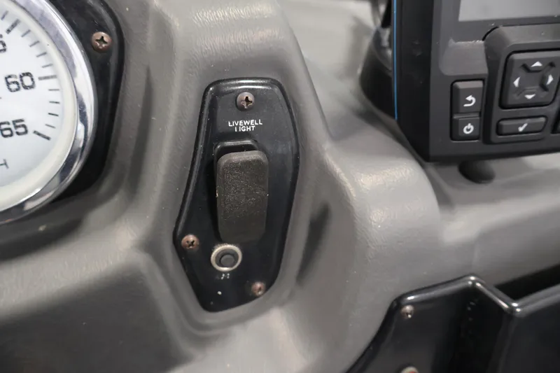 Slide: The Image of Dashboard of 2019 Crestliner 1800 Kodiak SC with livewell light switch. - 28