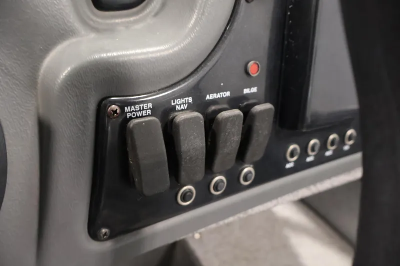 Slide: The Image of Control panel of 2019 Crestliner 1800 Kodiak SC boat with switches for power, lights, aerator, and bilge. - 29