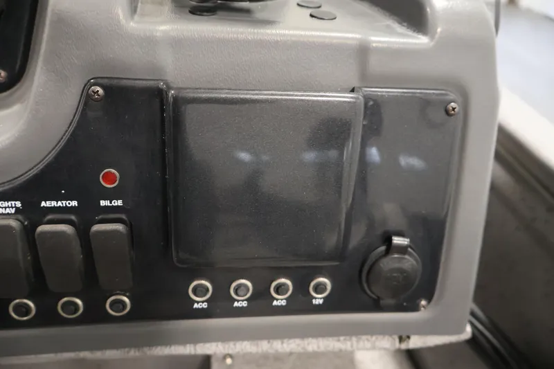 Slide: The Image of Control panel of 2019 Crestliner 1800 Kodiak SC boat with switches and ports. - 30