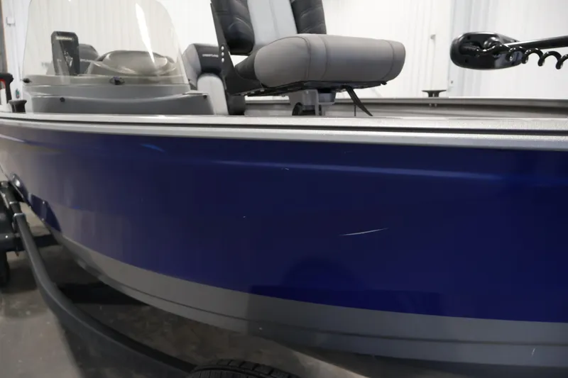 Slide: The Image of 2019 Crestliner 1800 Kodiak SC boat with blue exterior and seating. - 49