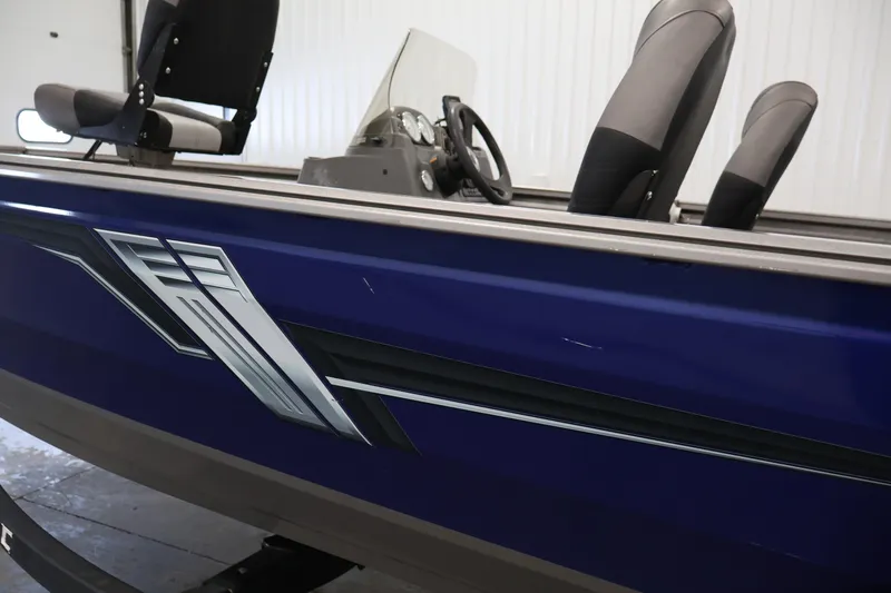 Slide: The Image of 2019 Crestliner 1800 Kodiak SC boat interior with blue exterior and seating. - 51