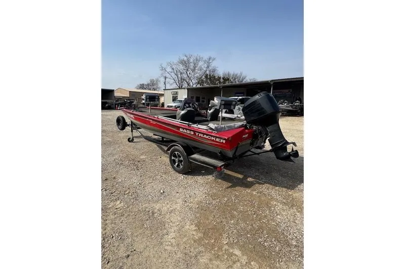 Slide: The Image of 2005 Tracker Pro Team 175 bass boat with outboard motor on trailer. - 4