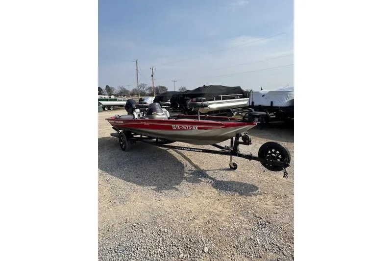 Slide: The Image of 2005 Tracker Pro Team 175 boat on trailer, parked on gravel lot. - 5