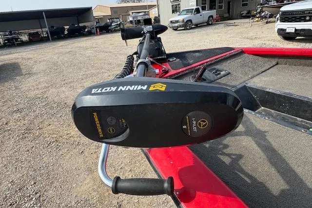 Slide: The Image of 2005 Tracker Pro Team 175 boat with Minn Kota trolling motor in a gravel lot. - 9