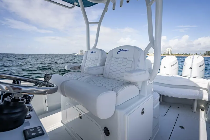 Slide: The Image of 2025 Yellowfin 34 Offshore boat interior with luxurious seating and ocean view. - 15