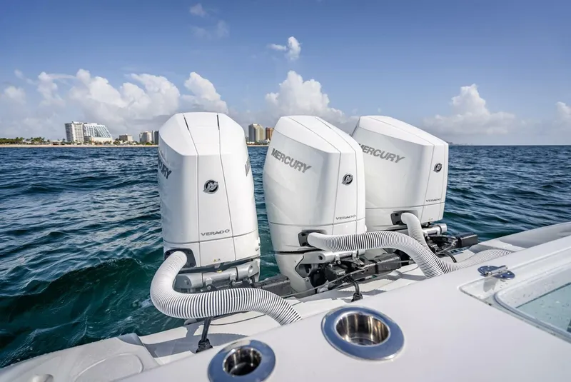Slide: The Image of 2025 Yellowfin 34 Offshore boat with triple Mercury Verado engines on open sea. - 26