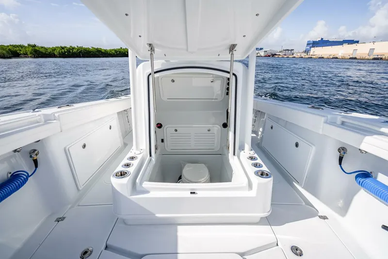 Slide: The Image of 2025 Yellowfin 34 Offshore boat interior with open hatch and ocean view. - 33
