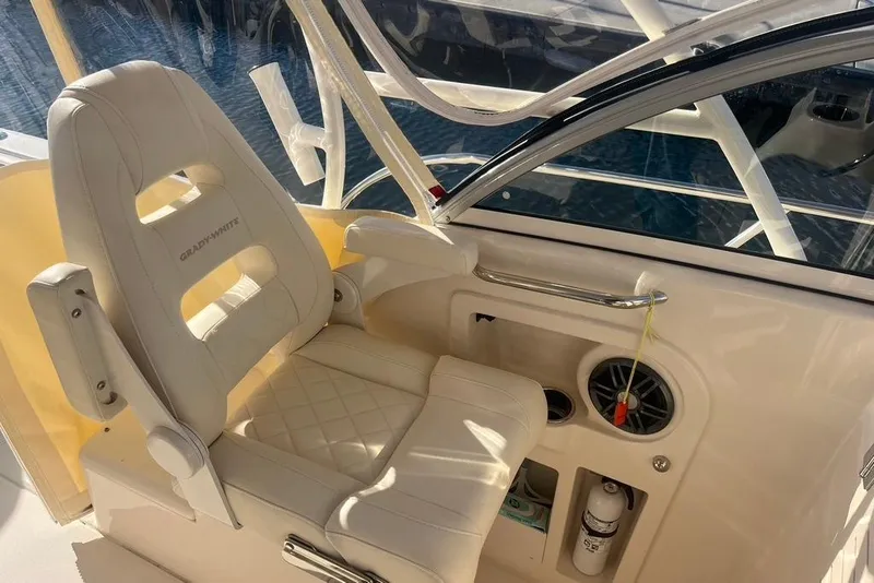 Slide: The Image of 2023 Grady-White Adventure 218 with Yamaha outboard motor on water. - 11